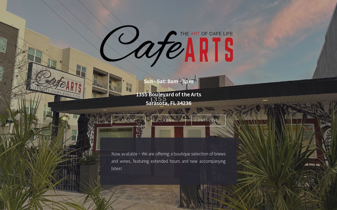 Cafe Arts exterior with hand-painted vine mural